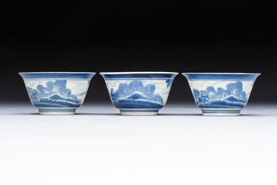 Three Japanese Arita blue and white &lsquo;Van Frytom&rsquo; cups and four shield-shaped saucers, Ming and Chenghua mark, ca. 1700