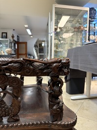 A richly carved Chinese hongmu 'dragon' armchair, Canton, 19th C.