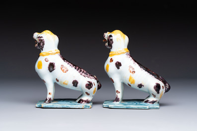 A pair of polychrome Dutch Delft models of dogs, 18th C.
