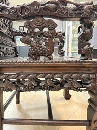 A richly carved Chinese hongmu 'dragon' armchair, Canton, 19th C.