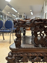 A richly carved Chinese hongmu 'dragon' armchair, Canton, 19th C.