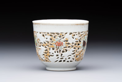 A pair of Chinese famille rose gilt-decorated covered cups and saucers and an openworked cup, Qianlong