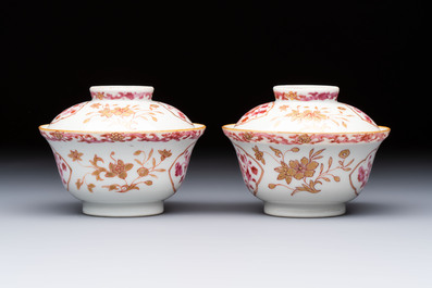 A pair of Chinese famille rose gilt-decorated covered cups and saucers and an openworked cup, Qianlong