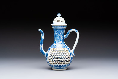 A rare Chinese blue and white reticulated double-walled ewer and cover with floral design, Kangxi