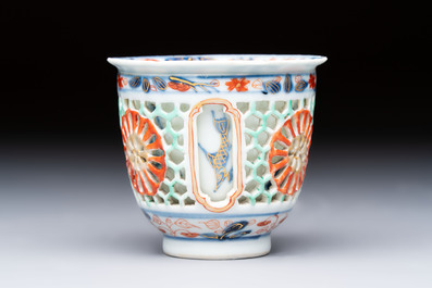 A rare Chinese famille verte reticulated double-walled cup and saucer, artemisia leaf mark, Kangxi