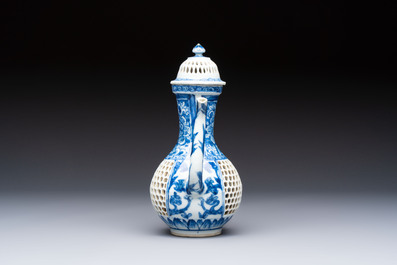 A rare Chinese blue and white reticulated double-walled ewer and cover with floral design, Kangxi