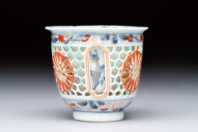 A rare Chinese famille verte reticulated double-walled cup and saucer, artemisia leaf mark, Kangxi