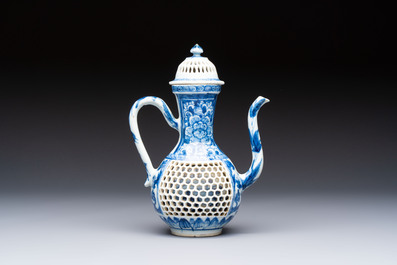 A rare Chinese blue and white reticulated double-walled ewer and cover with floral design, Kangxi