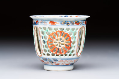 A rare Chinese famille verte reticulated double-walled cup and saucer, artemisia leaf mark, Kangxi