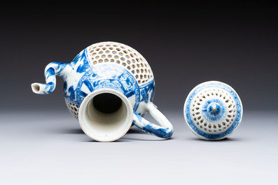 A rare Chinese blue and white reticulated double-walled ewer and cover with floral design, Kangxi