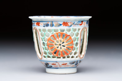 A rare Chinese famille verte reticulated double-walled cup and saucer, artemisia leaf mark, Kangxi