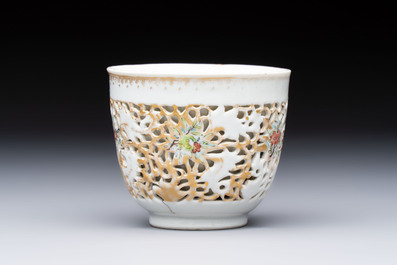 A pair of Chinese famille rose gilt-decorated covered cups and saucers and an openworked cup, Qianlong