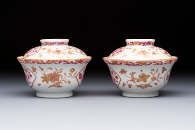 A pair of Chinese famille rose gilt-decorated covered cups and saucers and an openworked cup, Qianlong