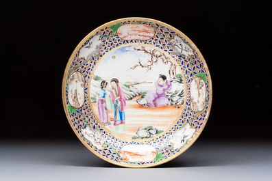 A Chinese famille rose gilt-decorated cup and saucer with figural design, Jiaqing