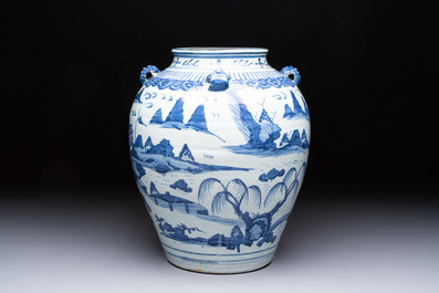A Chinese blue and white 'Mountainous Landscape' vase with four lion-form handles, 16/17th C.