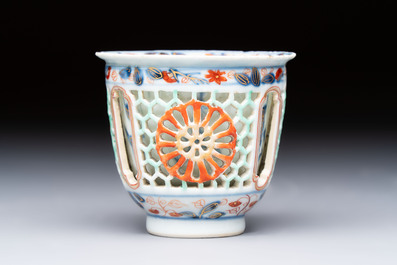 A rare Chinese famille verte reticulated double-walled cup and saucer, artemisia leaf mark, Kangxi