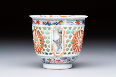 A rare Chinese famille verte reticulated double-walled cup and saucer, artemisia leaf mark, Kangxi
