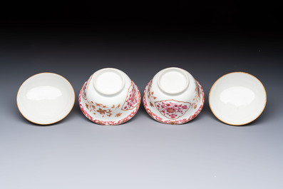 A pair of Chinese famille rose gilt-decorated covered cups and saucers and an openworked cup, Qianlong