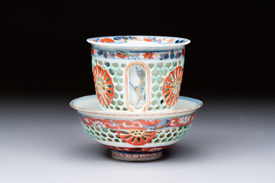 A rare Chinese famille verte reticulated double-walled cup and saucer, artemisia leaf mark, Kangxi