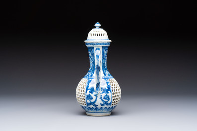 A rare Chinese blue and white reticulated double-walled ewer and cover with floral design, Kangxi