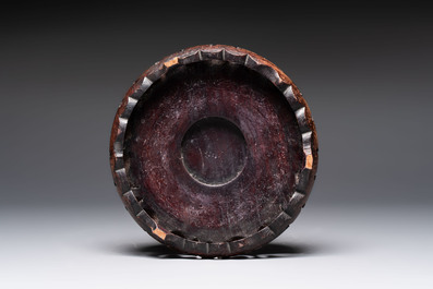 A Chinese flamb&eacute;-glazed vase on a wooden stand, 19th C.