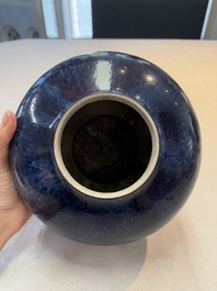 A Chinese flamb&eacute;-glazed vase on a wooden stand, 19th C.