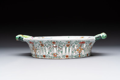 A polychrome Dutch Delft petit feu reticulated basket after a Chinese famille rose example, 18th C.