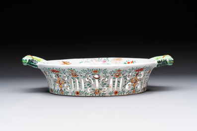 A polychrome Dutch Delft petit feu reticulated basket after a Chinese famille rose example, 18th C.
