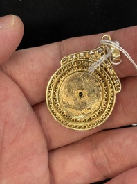 A diamond- and jadeite-inlaid gold pendant, 20th C.