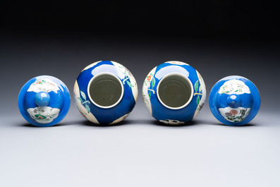Two Chinese famille verte blue-ground vases and covers, 19th C.