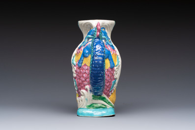 A Chinese famille rose ewer in the form of a dragon and two carps with wooden cover and stand, 19th C.