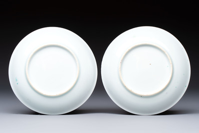 A pair of Chinese famille rose 'Taming the Tiger' saucers, Yongzheng