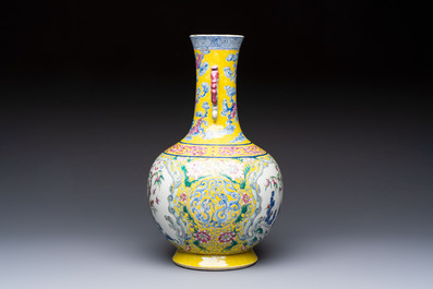 A Chinese famille rose yellow-ground &lsquo;Bats and Peaches&rsquo; bottle vase, Jiaqing/Daoguang