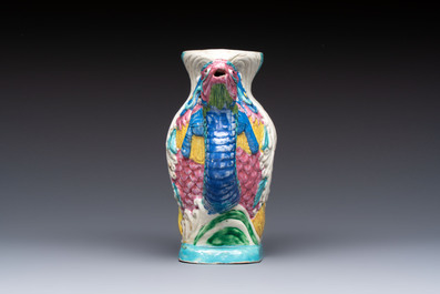 A Chinese famille rose ewer in the form of a dragon and two carps with wooden cover and stand, 19th C.