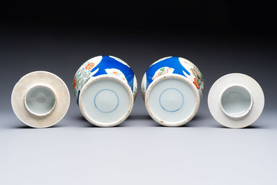 Two Chinese famille verte blue-ground vases and covers, 19th C.