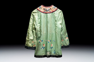 Two Chinese embroidered silk women&rsquo;s robes and an embroidered silk panel, 19th C.