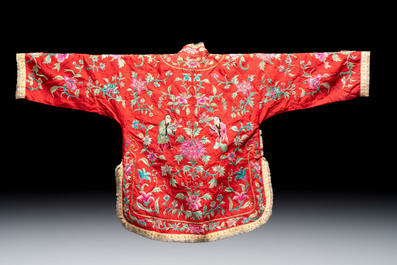 Two Chinese embroidered silk women&rsquo;s robes and an embroidered silk panel, 19th C.