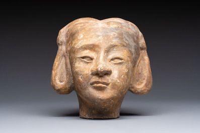 Two Chinese polychrome pottery figures and a female head, Tang