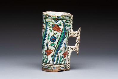 A polychrome Iznik mug, late 16th C.