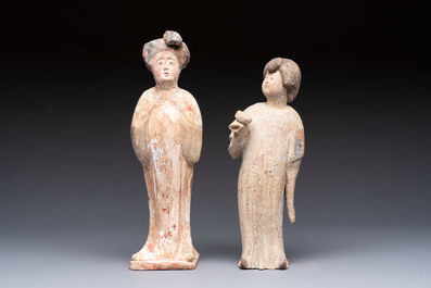 Two Chinese polychrome pottery figures and a female head, Tang