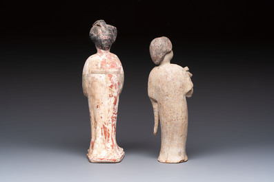 Two Chinese polychrome pottery figures and a female head, Tang