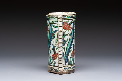A polychrome Iznik mug, late 16th C.