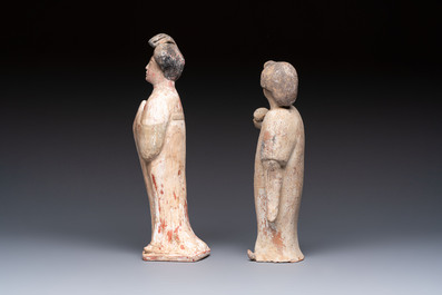 Two Chinese polychrome pottery figures and a female head, Tang