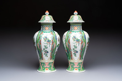 A pair of famille verte-style 'Lotus Pond and Flower Basket' vases and covers, Samson, Paris, 19th C.