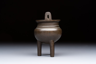 A Chinese silver-inlaid bronze tripod censer with clouds design, 19th C.