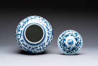 A Chinese blue and white vase and cover with floral design, Kangxi