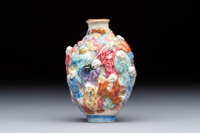 A Chinese famille rose moulded '18 Luohan' snuff bottle, Qianlong mark, 19th C.
