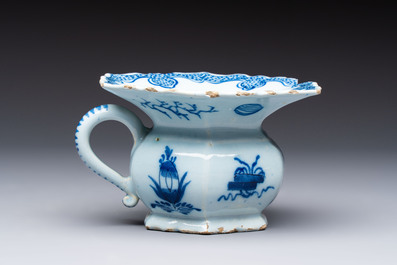 A blue and white Dutch Delft spittoon, 18th C.