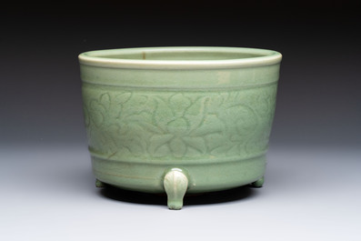 A large Chinese Longquan celadon tripod censer with floral design, Ming