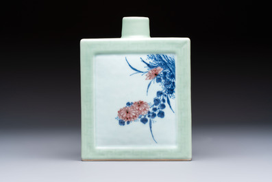 A Chinese blue, white and copper-red celadon-ground tea caddy with floral and bamboo design, Qianlong mark and of the period
